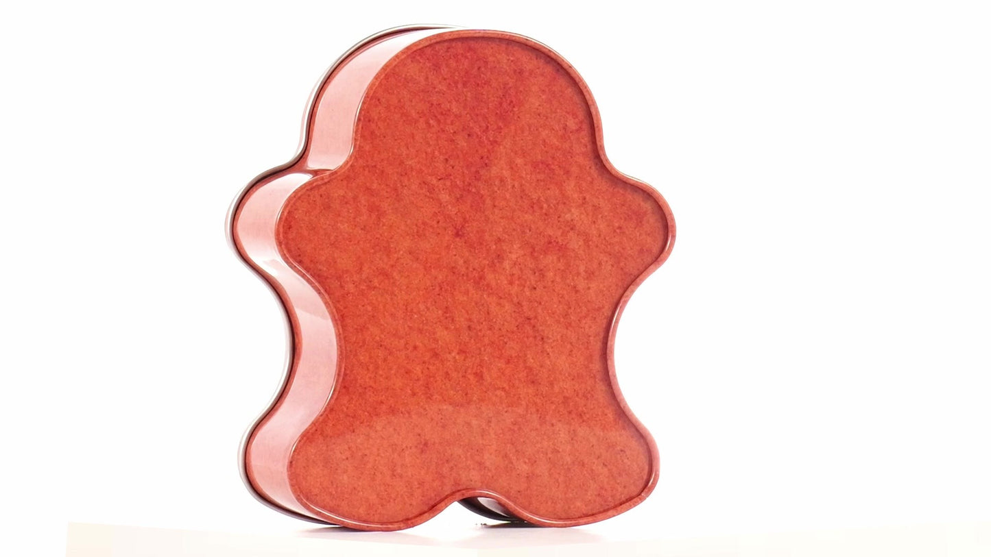 Metal box in the shape of a gingerbread man