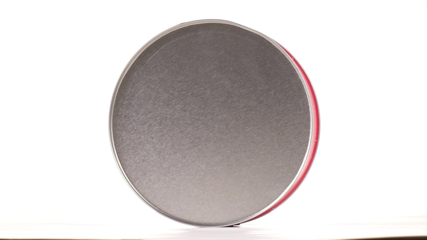 Red round metal box with Santa Claus pattern