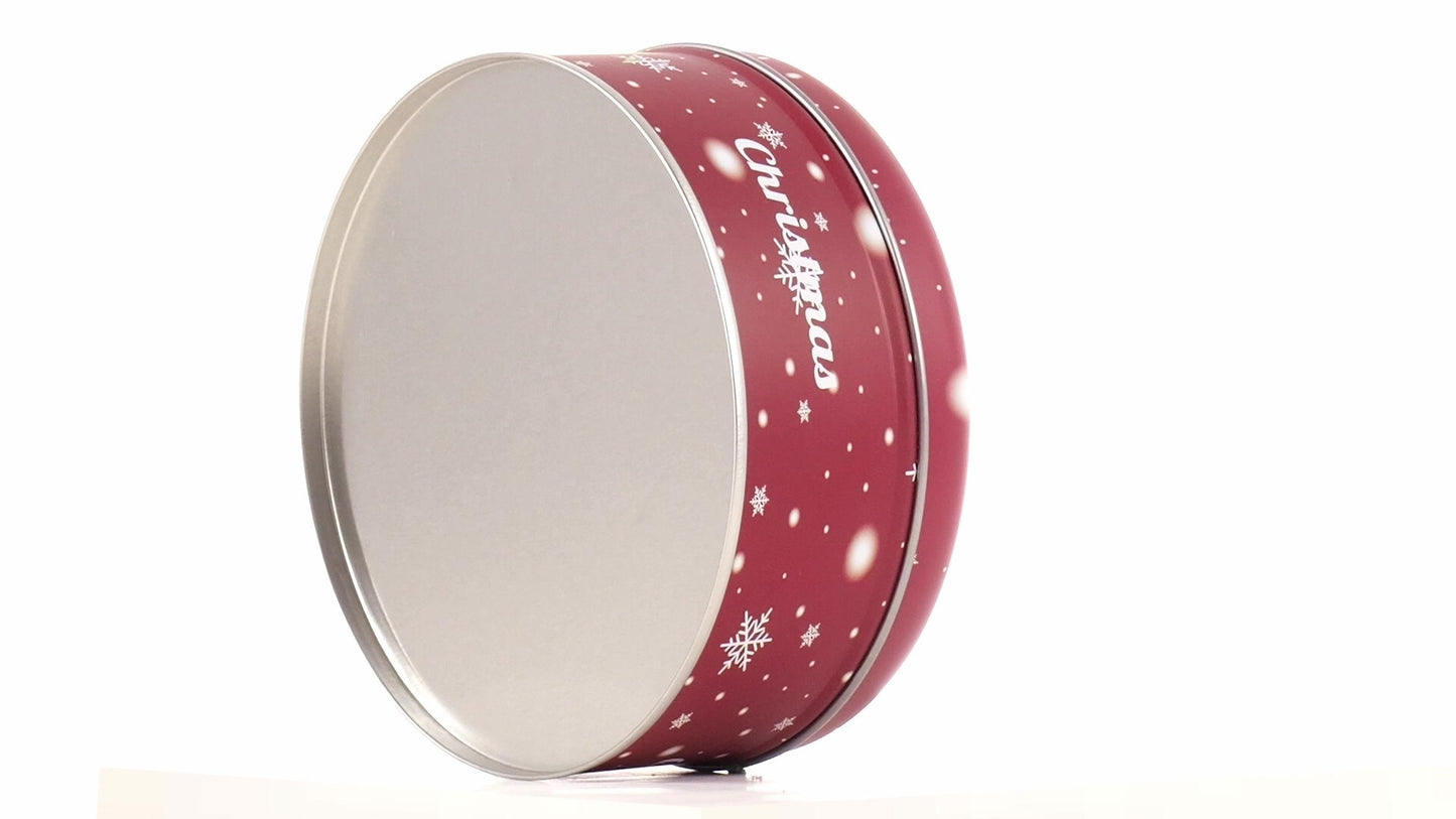 Red round metal box with Christmas reindeer pattern