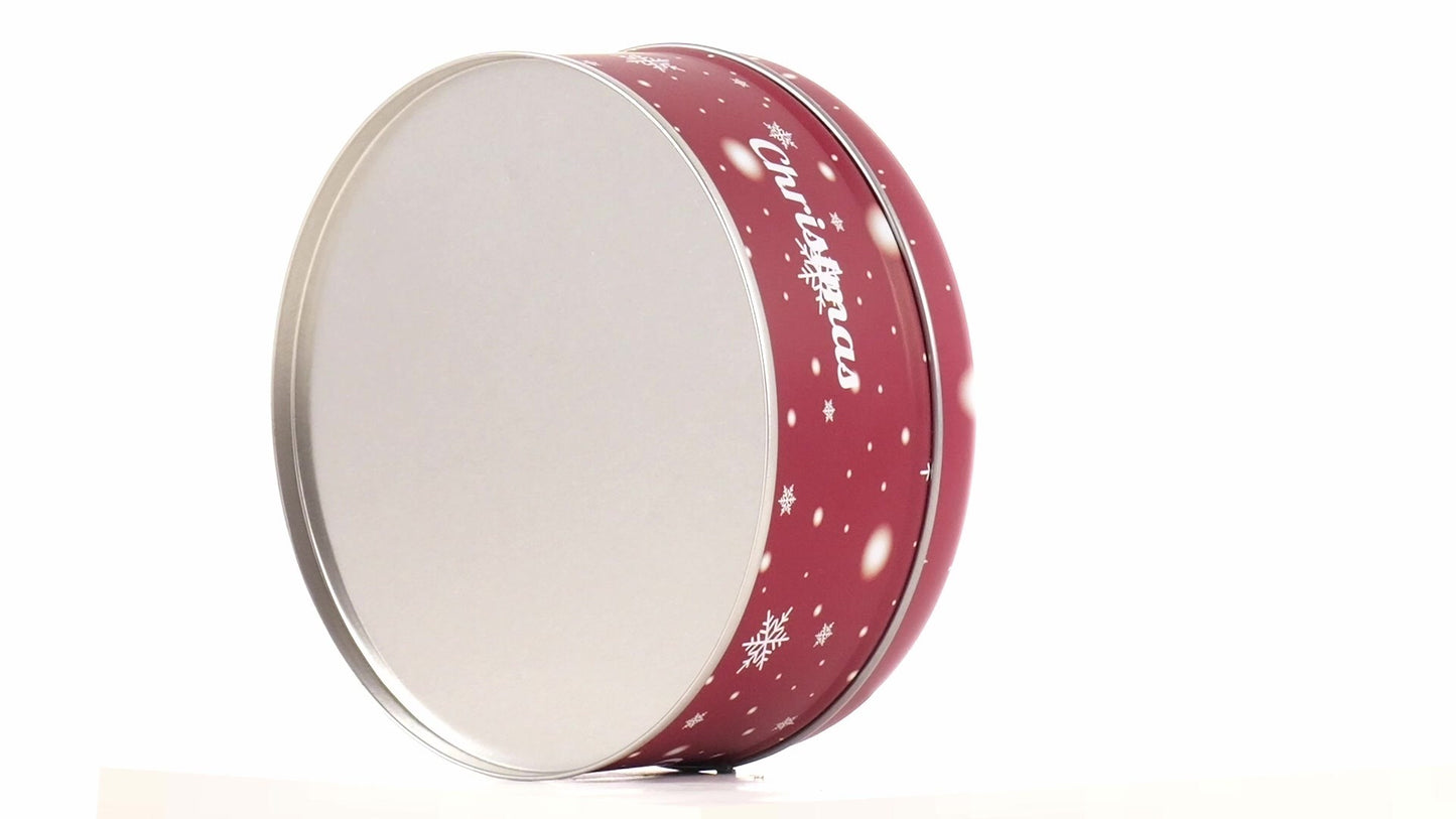 Round red metal tin with Christmas reindeer pattern