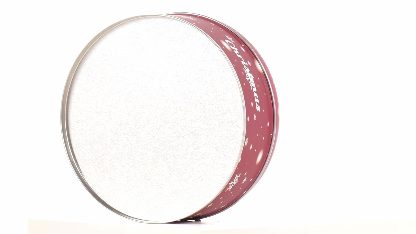 Round red metal tin with Christmas reindeer pattern