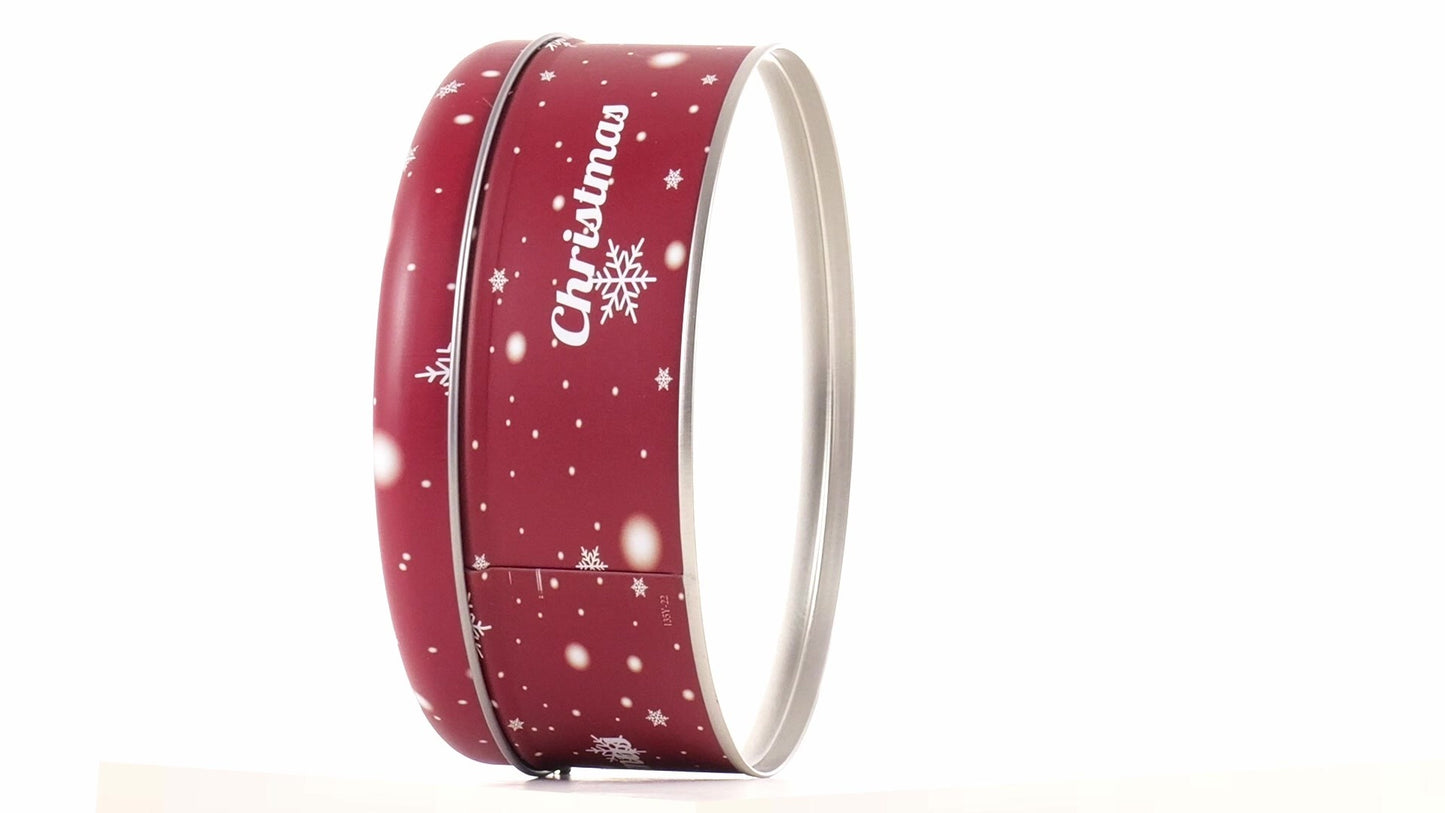 Round red metal tin with Christmas reindeer pattern