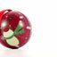Red metal Christmas tree ornament with reindeer pattern Ø7 cm