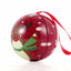 Red metal Christmas tree ornament with reindeer pattern Ø7 cm